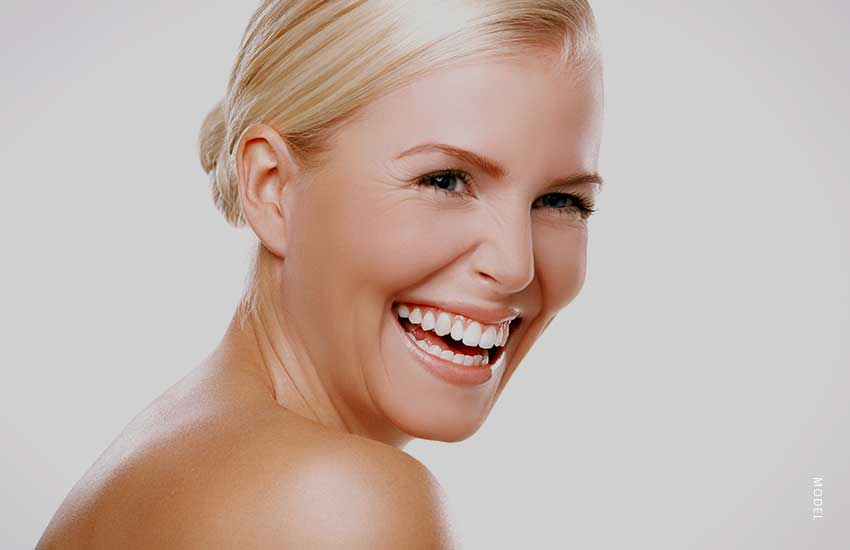 headshot of a smiling blonde woman